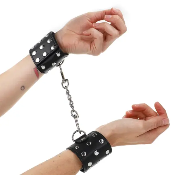 KINK - VERSTELBARE POLSBANDJES MET KNOPPEN EN KLIKSLUITING ZWART 19-24 CM X 5,5 CM